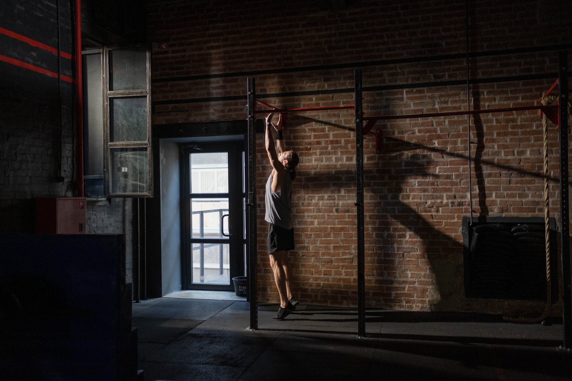 A man getting ready to do a pull up exercise.